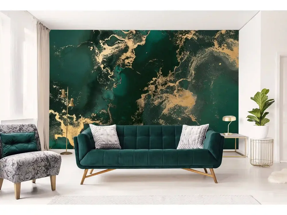Emerald and gold marbled mural behind a green velvet sofa