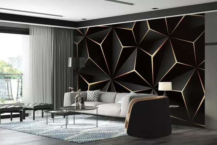 Black faceted geometric wallcovering with gold lines in a modern living space